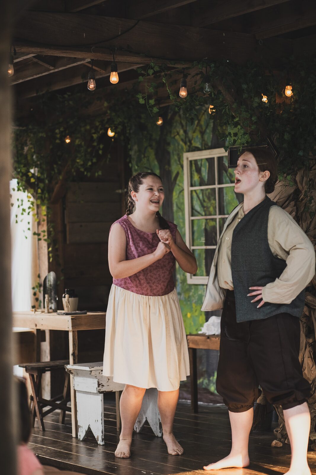 Hansel and Gretel together outside the cottage